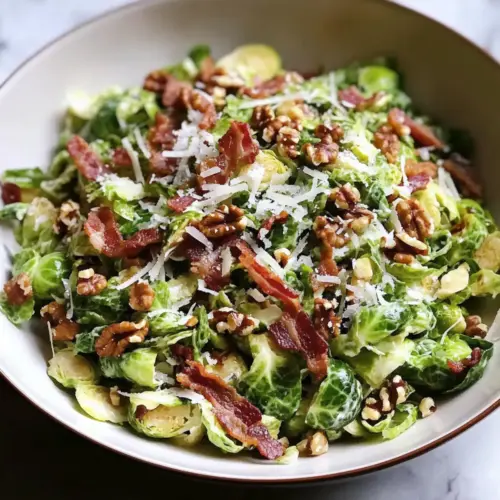 Shaved Brussels Sprout Salad with Crispy Bacon, Parmesan, and Toasted Walnuts